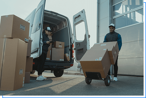 Male courier pushing a cart while a female coworker checking the number of freight boxes